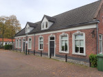 Dubbele woning te Westerhoven met snijvoegwerk.